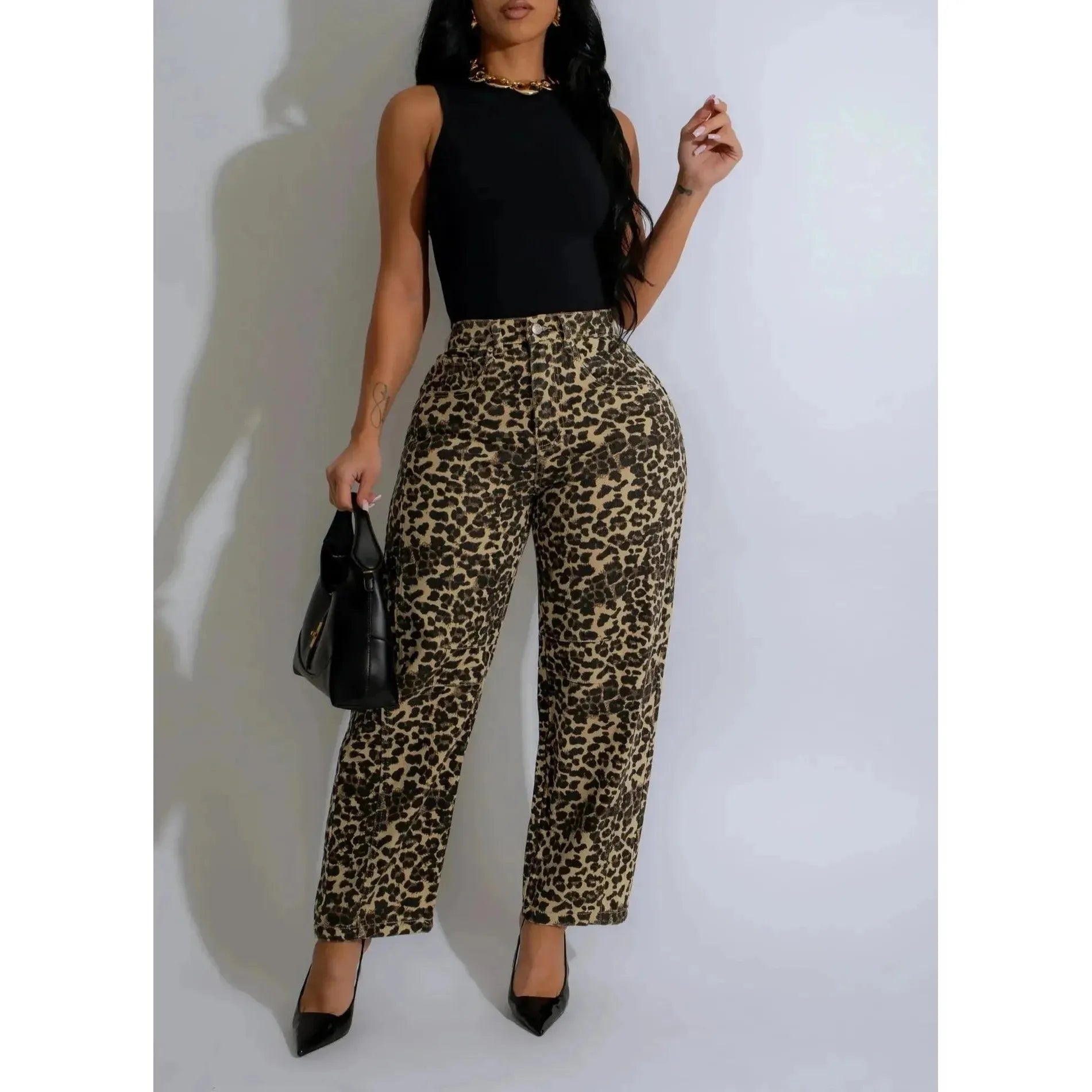100% Cotton Mid rise leopard print jeans with a barrel shape back pockets  and ankle length 