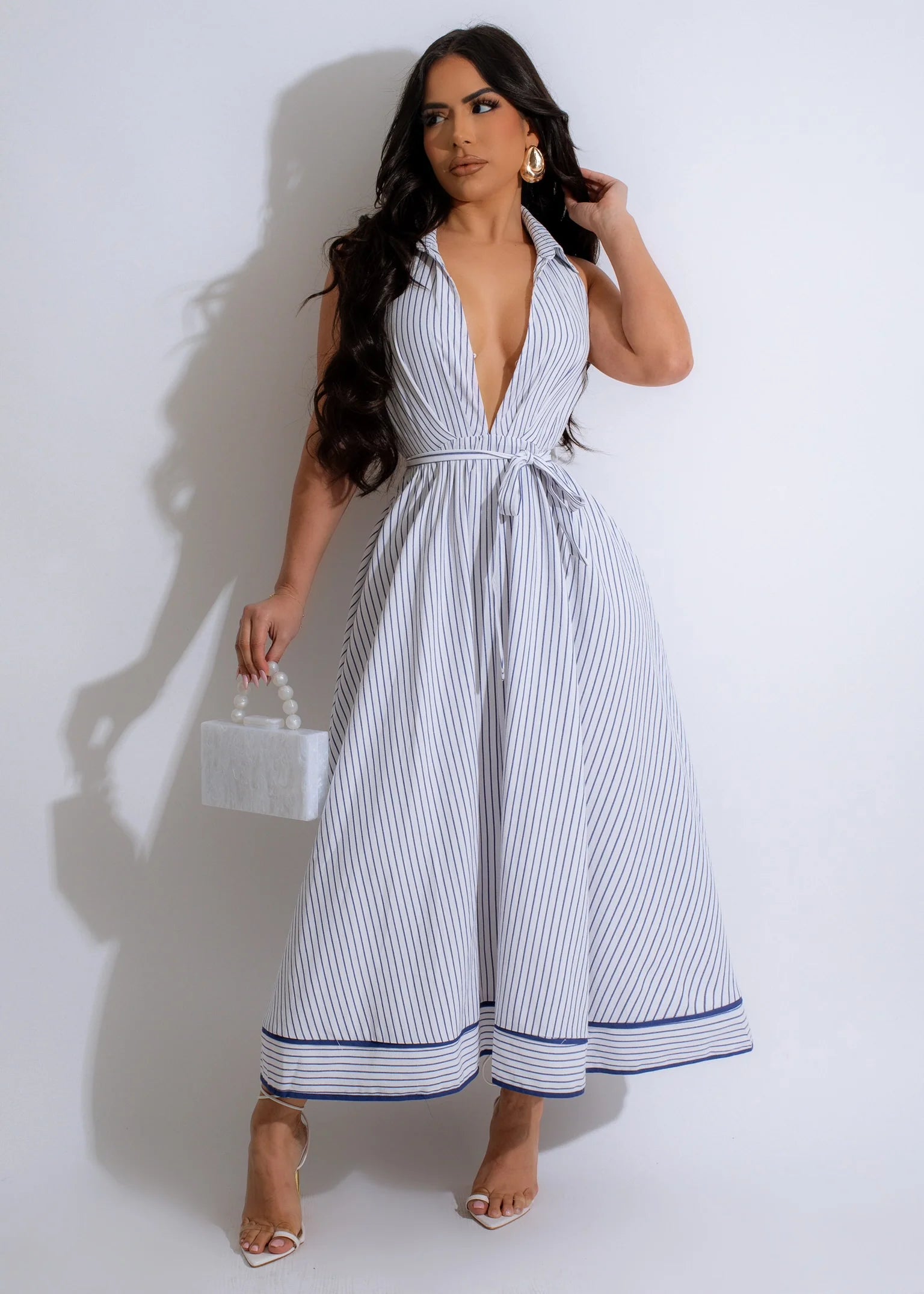 Pinstripe Millionaire Bae Midi Dress BlueSimplyDerri

Elevate your style with elegance through our Pinstripe Millionaire Bae Midi Dress, a sophisticated garment that adds a modern touch to a classic design. This refinDressPinstripe Millionaire Bae Midi Dress Blue