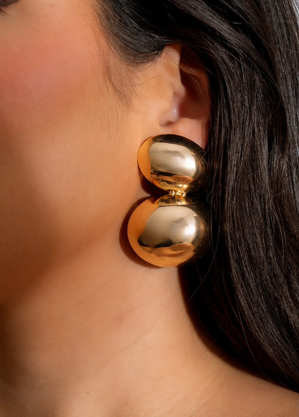 Gold round double spherical earrings , spheres layered one on top the other 