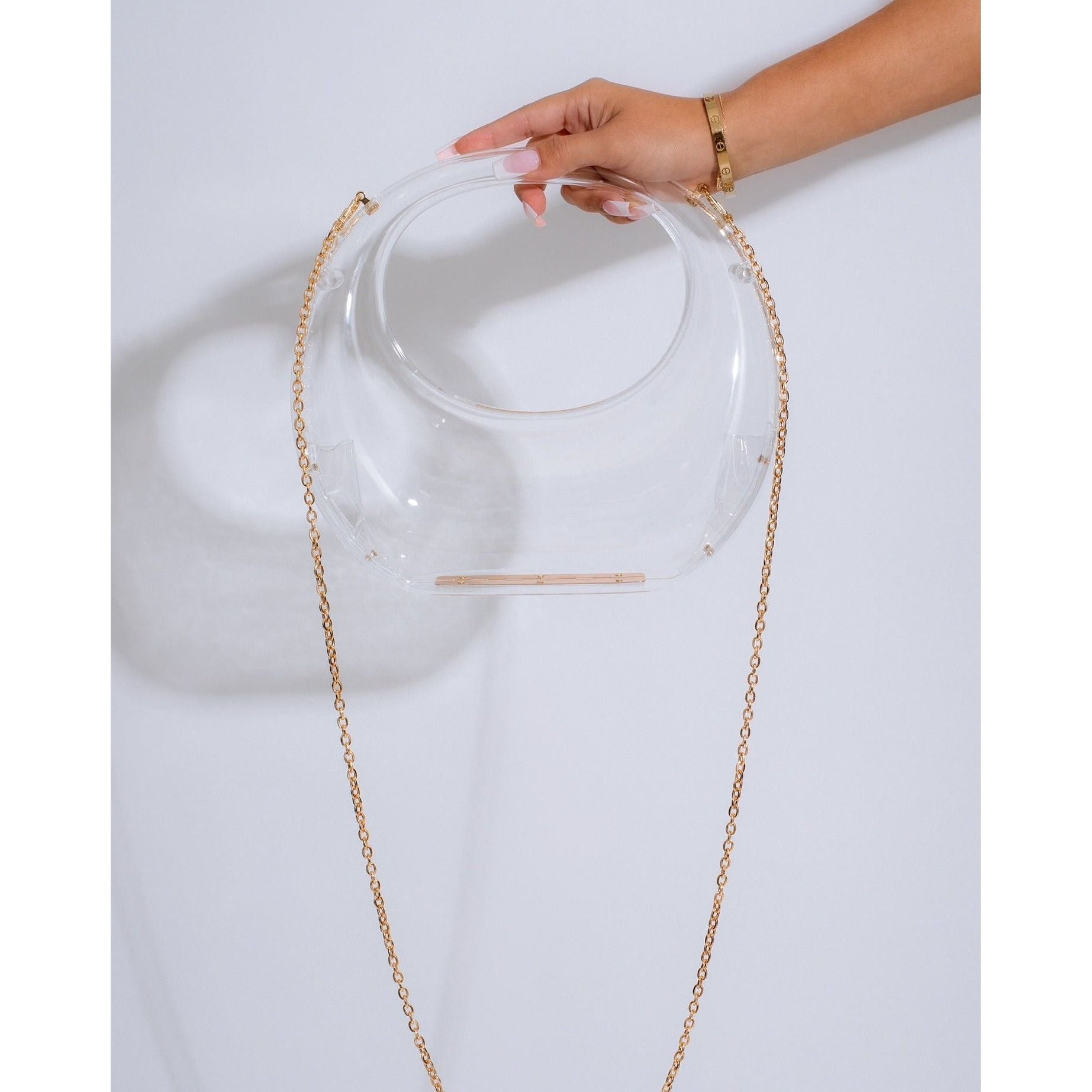 KARA ACRYLIC HANDBAG CLEARSimplyDerriOur Kara Clear Acrylic Handbag is the ideal bag for those who desire a distinct look. Made with superior materials, this handbag boasts an attractive design that wilACCESSORIESKARA ACRYLIC HANDBAG CLEAR