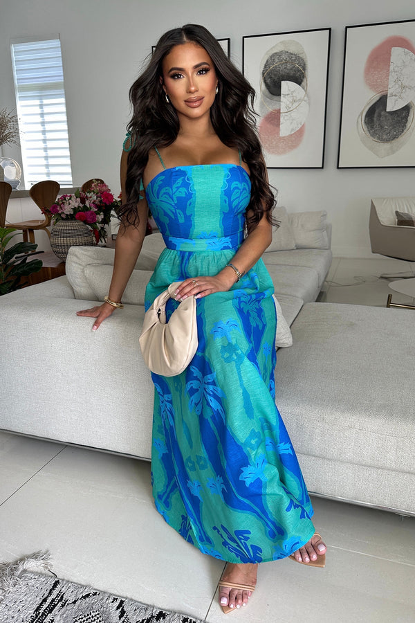 Turquoise and blue intricate patterns inspired by palm trees and the ocean Maxi dress with a flattering fitted bodice,  flowy skirt and adjustable shoulder tie straps with tassles. 